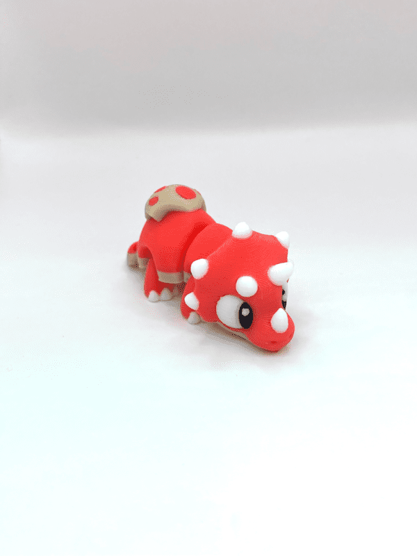 rumble the triceratops fidget toy in cherry red