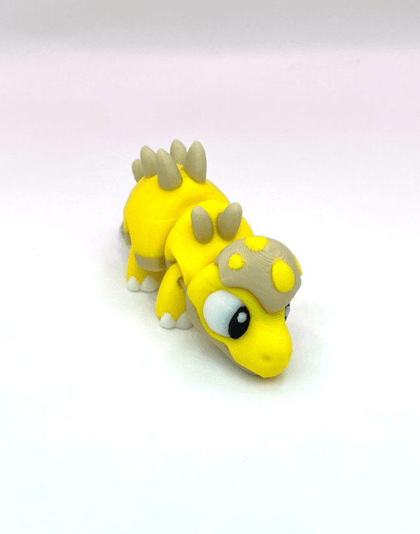 Stomp The Stegosaurus 3D printed fidget toy spikey yellow dinosaur